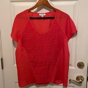 Calvin Klein woman’s coral short sleeved blouse.